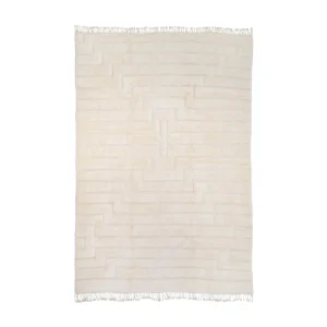 A rectangular, cream-colored rug showcases a striking geometric pattern with fringed edges, adding elegance and style to any room. Perfect for those seeking a touch of sophistication.