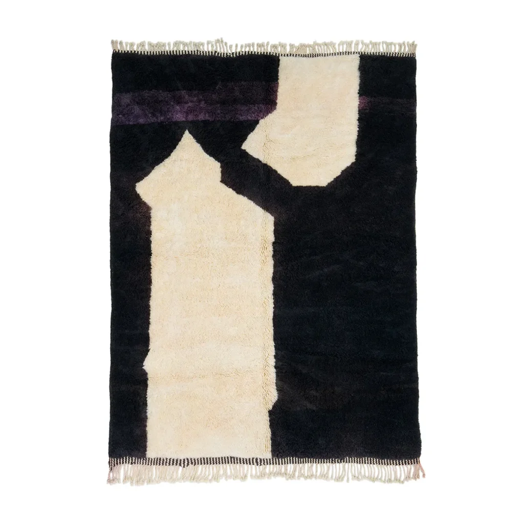 This luxurious rug showcases a stunning geometric pattern with cream and black shapes, beautifully hand-knotted to perfection. Fringed edges add a touch of elegance, making it a standout piece for any room.