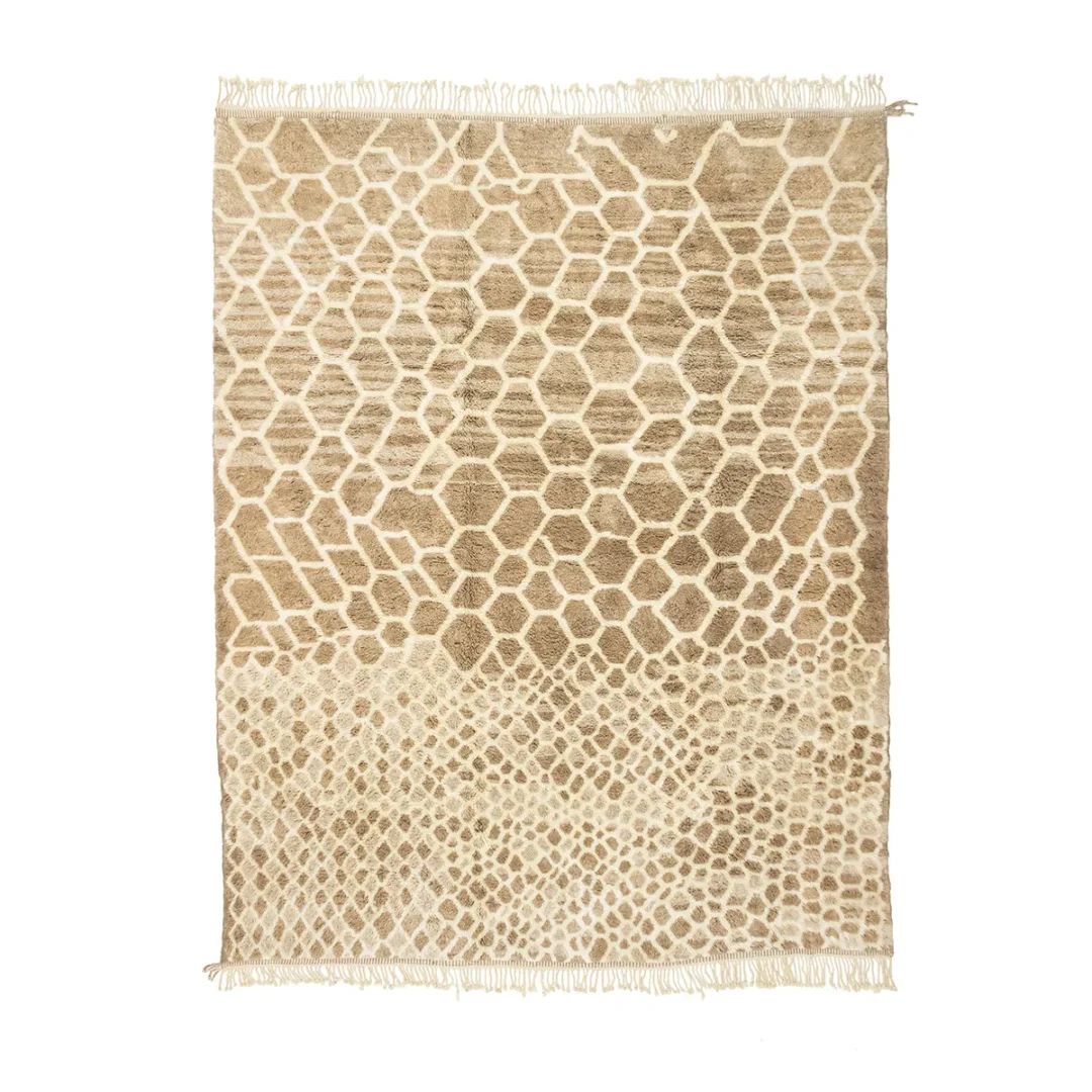 This hand-knotted, beige and brown rug features a geometric honeycomb pattern, reminiscent of authentic Moroccan rugs. Its artisanal design is complemented by fringe on the shorter sides, adding a touch of elegance to any room.