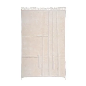 An artisanal rug in beige showcases a textured, geometric design with raised lines and fringed edges. This hand-knotted piece captures the essence of authentic Moroccan rugs, adding elegance and warmth to any space.