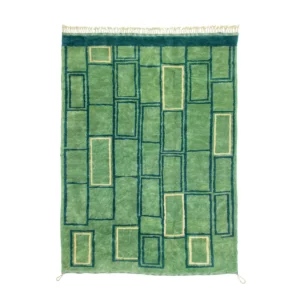 An artisanal, hand-knotted green rug showcases a geometric pattern of overlapping rectangles in various shades of green and blue, complete with fringes on the shorter ends.