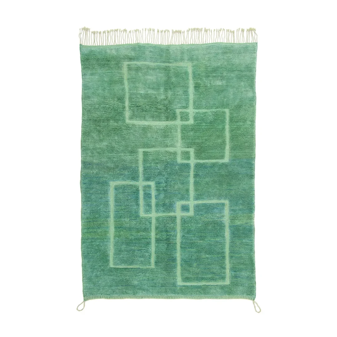 This artisanal rug showcases abstract geometric line patterns in various rectangles, adding a touch of sophistication to any space. The hand-knotted design is completed with fringed edges at the top and bottom, reminiscent of authentic Moroccan rugs.