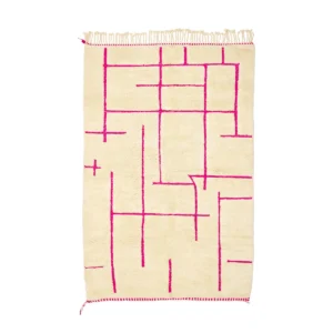 An artisanal beige rectangular rug with bright pink geometric line patterns and fringed edges, this hand-knotted piece brings a touch of elegance and cultural authenticity to any space.