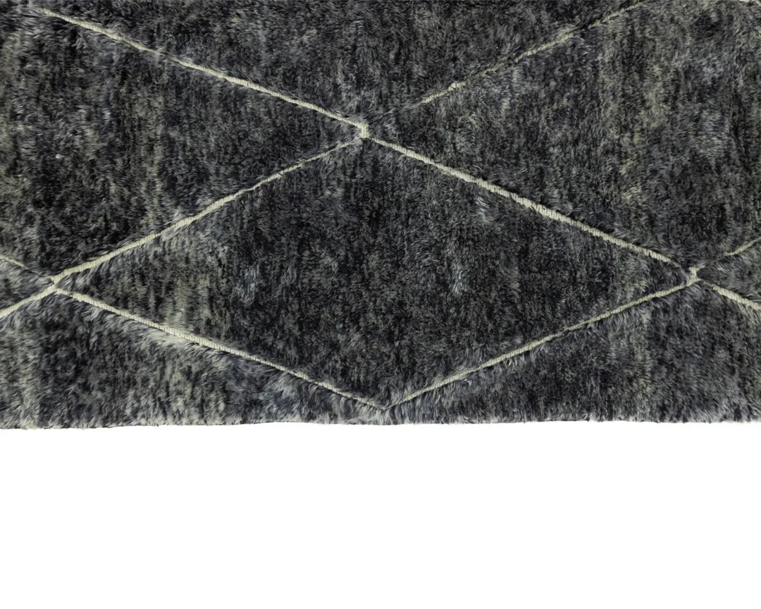 This gray textured rug features a hand-knotted diamond pattern against a white background, evoking the charm of authentic Moroccan rugs.
