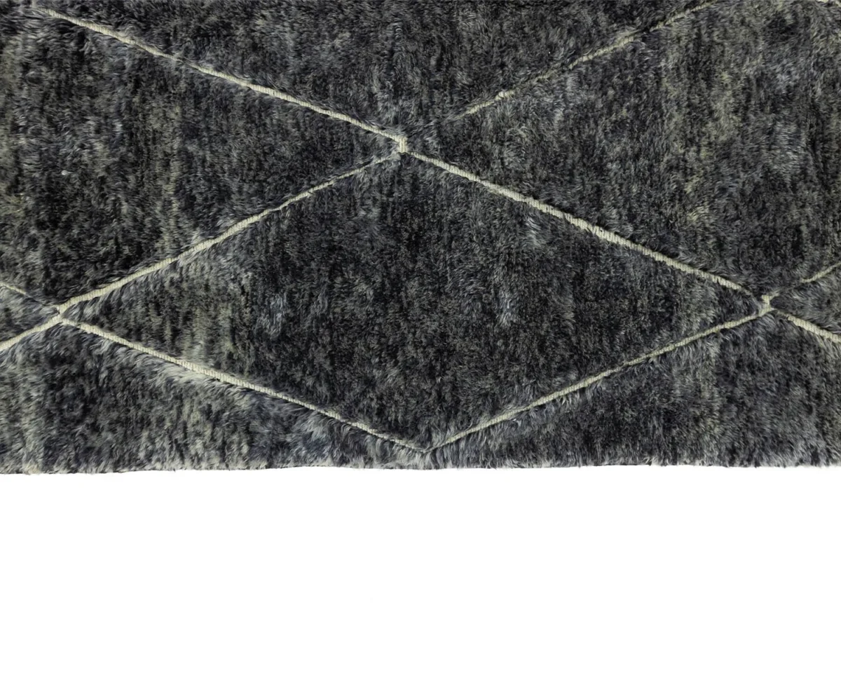 This gray textured rug features a hand-knotted diamond pattern against a white background, evoking the charm of authentic Moroccan rugs.