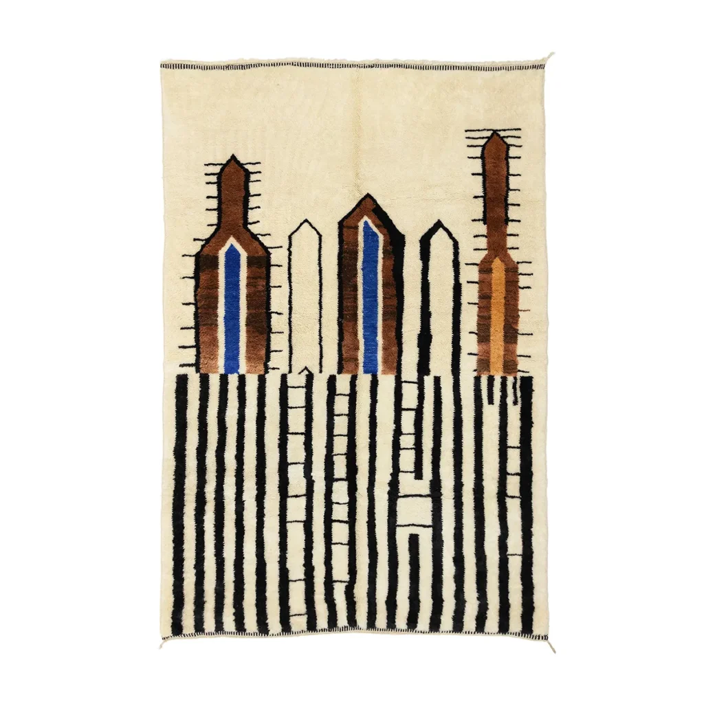 This hand-knotted geometric tapestry features vertical stripes in black and brown on a beige background, adorned with abstract shapes reminiscent of stylized buildings.