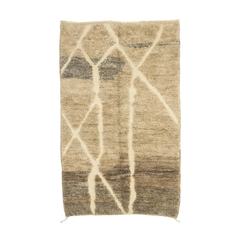 Discover an artisanal rug featuring abstract zigzag patterns in shades of brown and gray. Hand-knotted for quality, this piece adds a touch of elegance to any room with its authentic Moroccan inspiration.