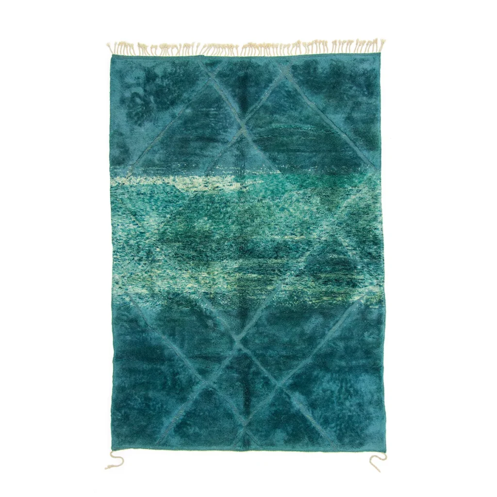 Experience the elegance of a hand-knotted Moroccan rug, featuring a teal and green textured design with a captivating diamond pattern and fringed edges.