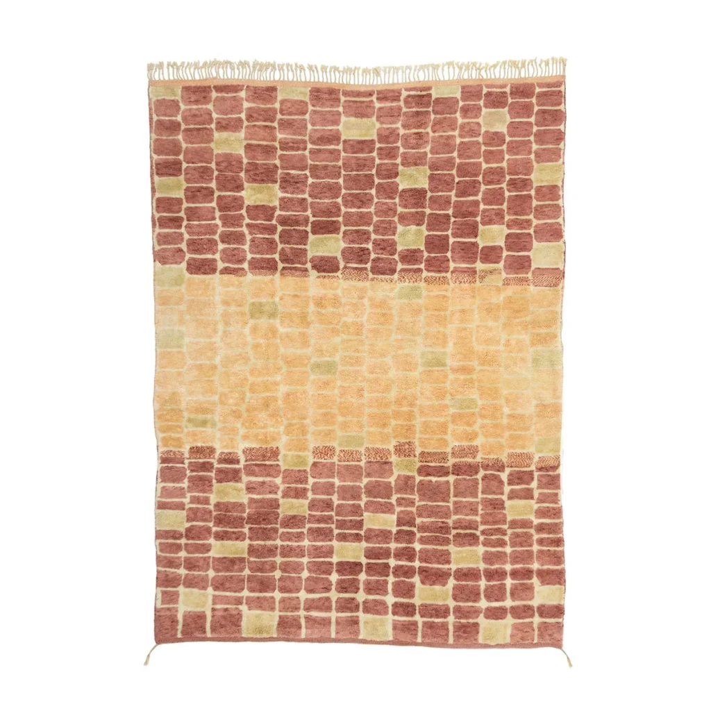 Experience the charm of an artisanal rug with its rectangular design showcasing a pattern of alternating rectangles in warm shades of brown, beige, and yellow. This hand-knotted piece features fringes on the top and bottom edges, adding a touch of elegance to any room.