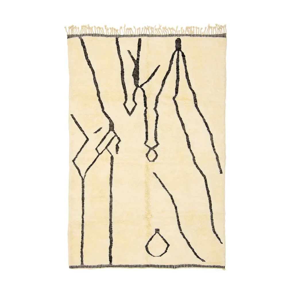 This luxurious, hand-knotted rectangular beige rug features abstract black line patterns and fringed edges on the shorter sides.