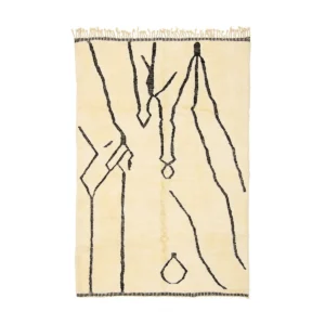 This luxurious, hand-knotted rectangular beige rug features abstract black line patterns and fringed edges on the shorter sides.