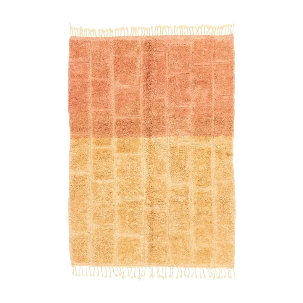 This luxurious hand-knotted rug showcases a gradient from orange to yellow, adorned with a sophisticated grid pattern and finished with fringe on two ends.