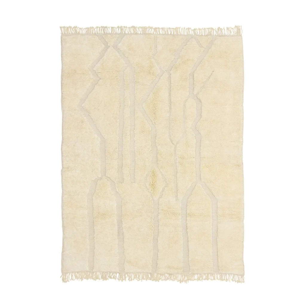 Beige luxury area rug featuring abstract linear designs with fringe on the edges.