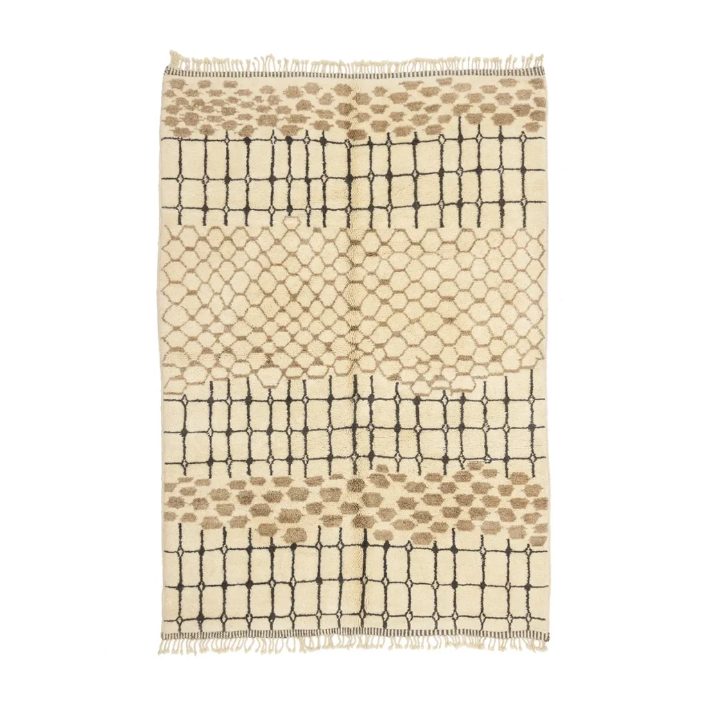 This authentic Moroccan rug features a beige and brown pattern with black grid lines and fringe edges. Hand-knotted for a touch of artisanal craftsmanship, it adds elegance and warmth to any space.