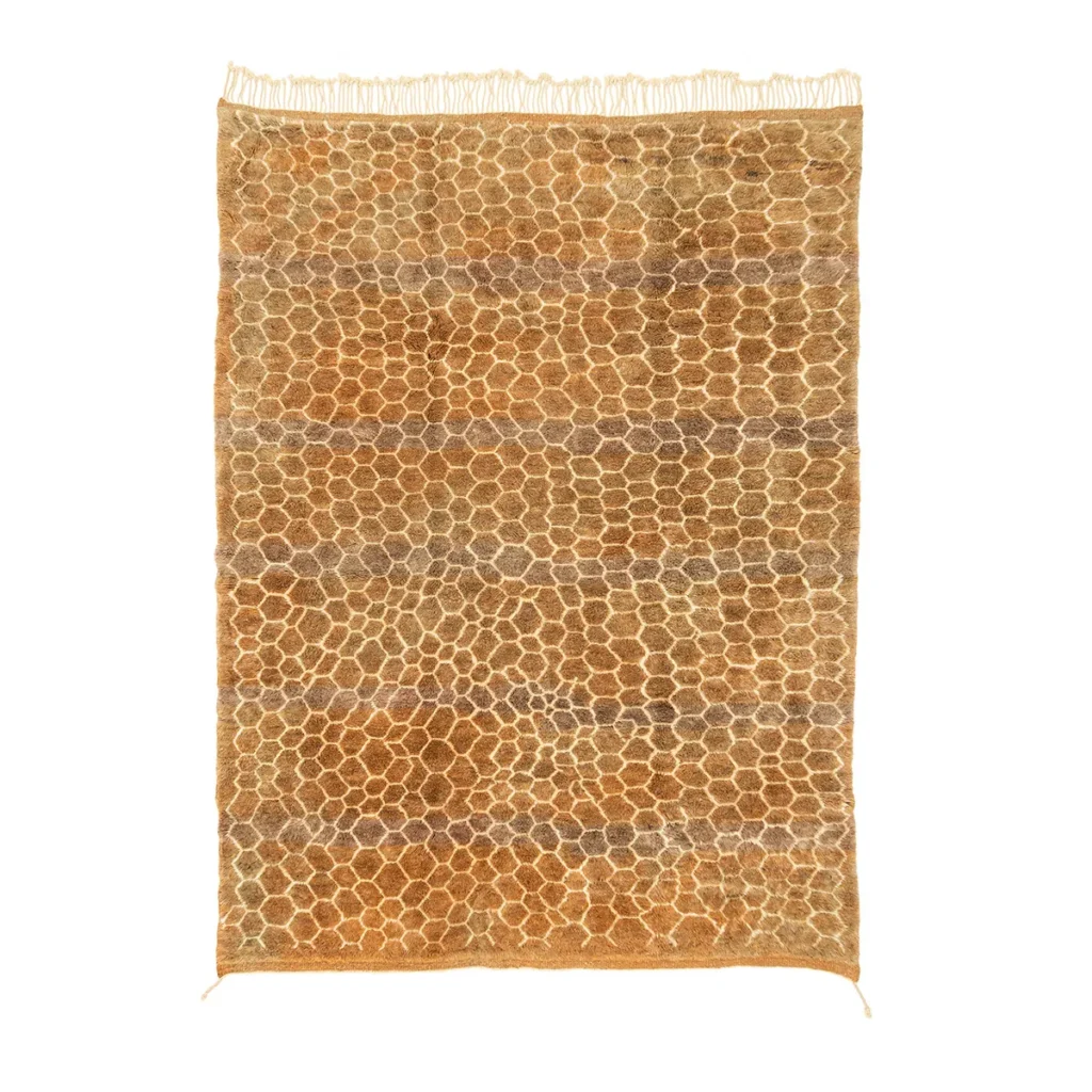 This luxurious rectangular rug features a beige and brown honeycomb pattern with elegant fringed edges, showcasing the intricate craftsmanship of a hand-knotted Moroccan design.