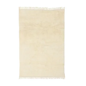 This hand-knotted, beige Moroccan rug features elegant fringe on the shorter sides and is beautifully showcased from above.