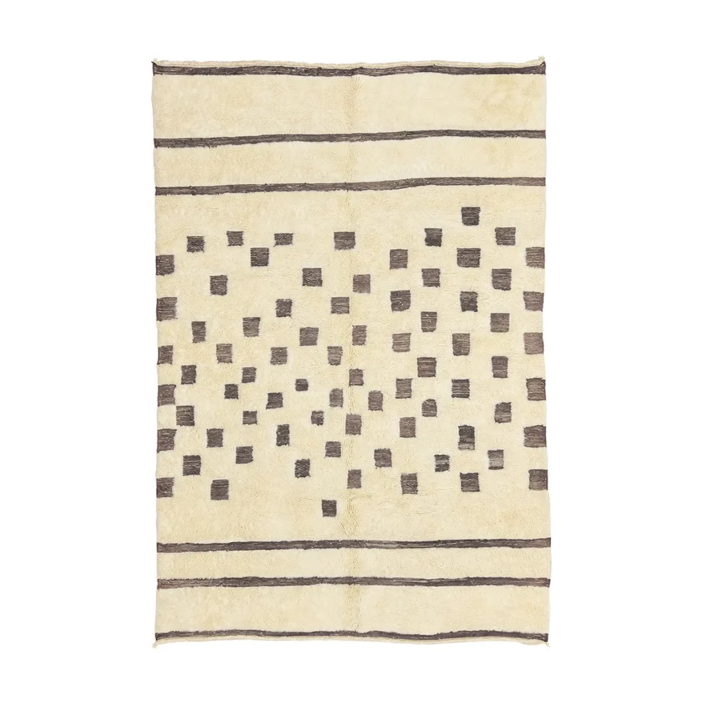 This luxury rug features a beige backdrop accentuated by a grid of dark square patterns and three horizontal lines at both the top and bottom. Expertly hand-knotted, it adds an elegant touch to any room.