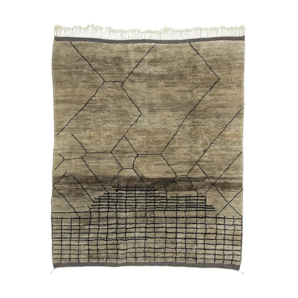 This artisanal rug features a beige and brown design with abstract geometric patterns, including intersecting lines and rectangles, enhanced by fringe on the top edge. Meticulously hand-knotted, it draws inspiration from authentic Moroccan rugs to add an elegant touch to your space.