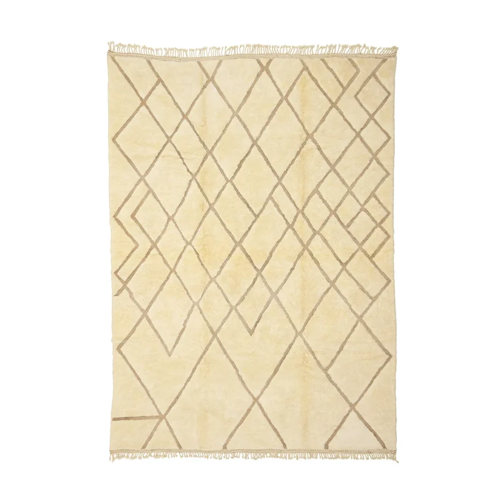 Experience the elegance of a luxury hand-knotted beige rug featuring a geometric diamond pattern and fringed edges.