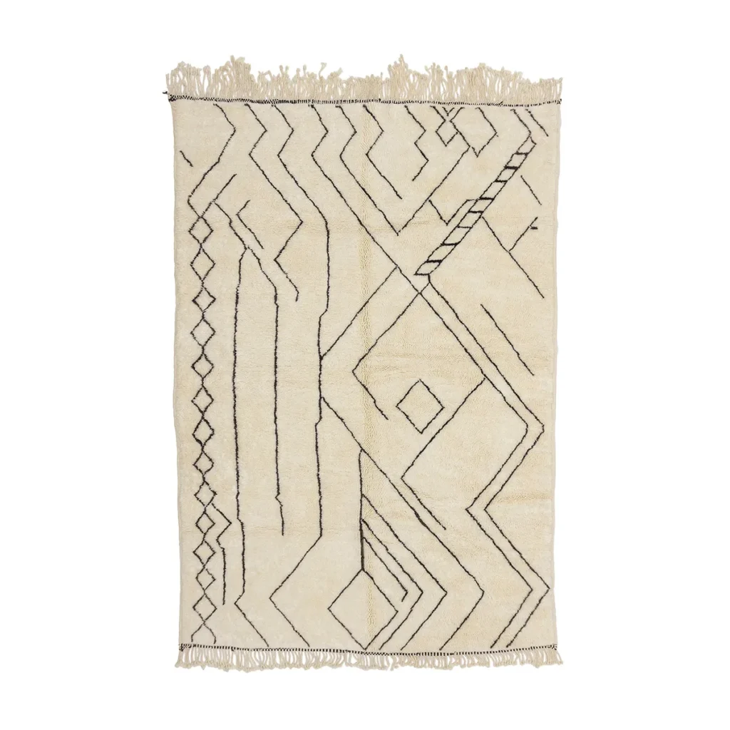 This hand-knotted beige rug showcases black geometric patterns and features fringed edges on two sides, adding a touch of luxury to any space.