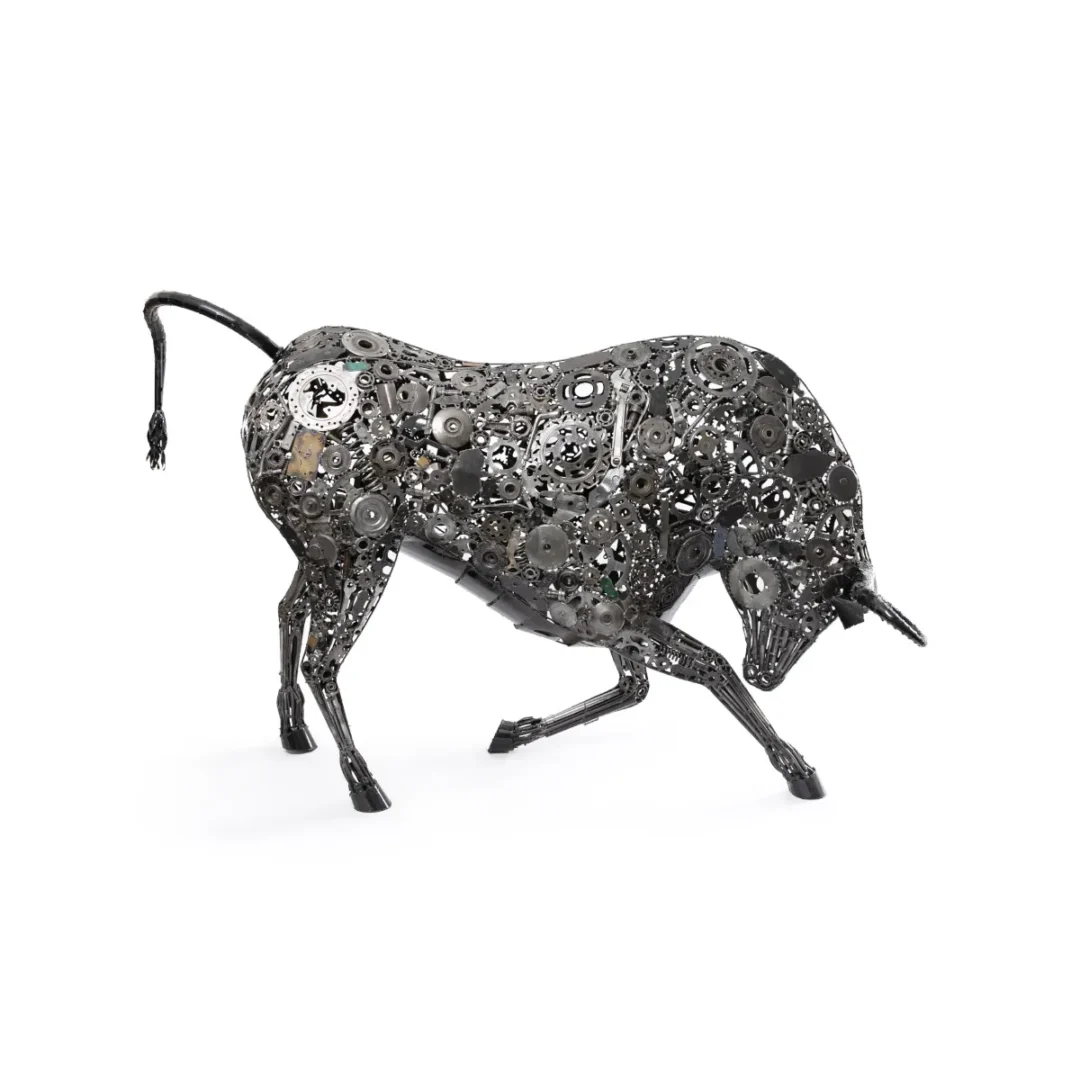 Dynamic metalwork sculpture of a bull crafted from recycled gears and mechanical parts, showcasing an impressive pose with its head lowered and tail raised.