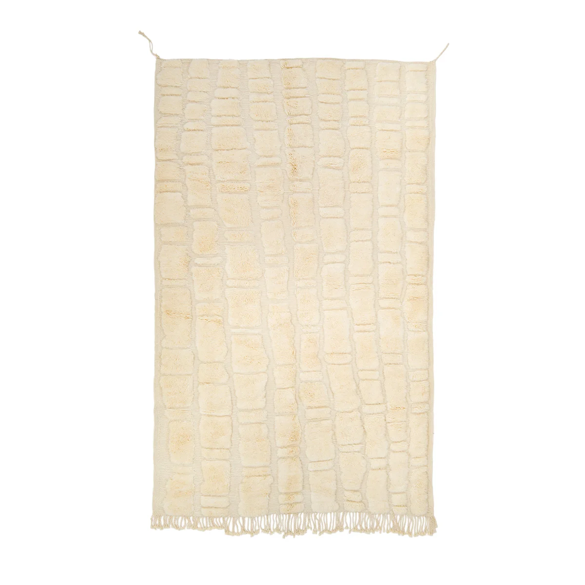 A cream-colored rug with a textured rectangular pattern and fringed edges.