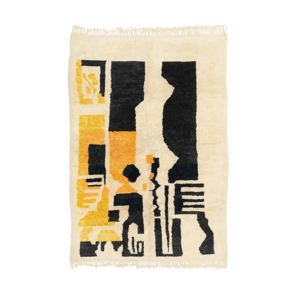 This hand-knotted rug boasts an abstract, geometric design in black, yellow, and orange on a beige background. Featuring bold vertical shapes and fringe along the edges, this artisanal piece adds a touch of elegance to any room.