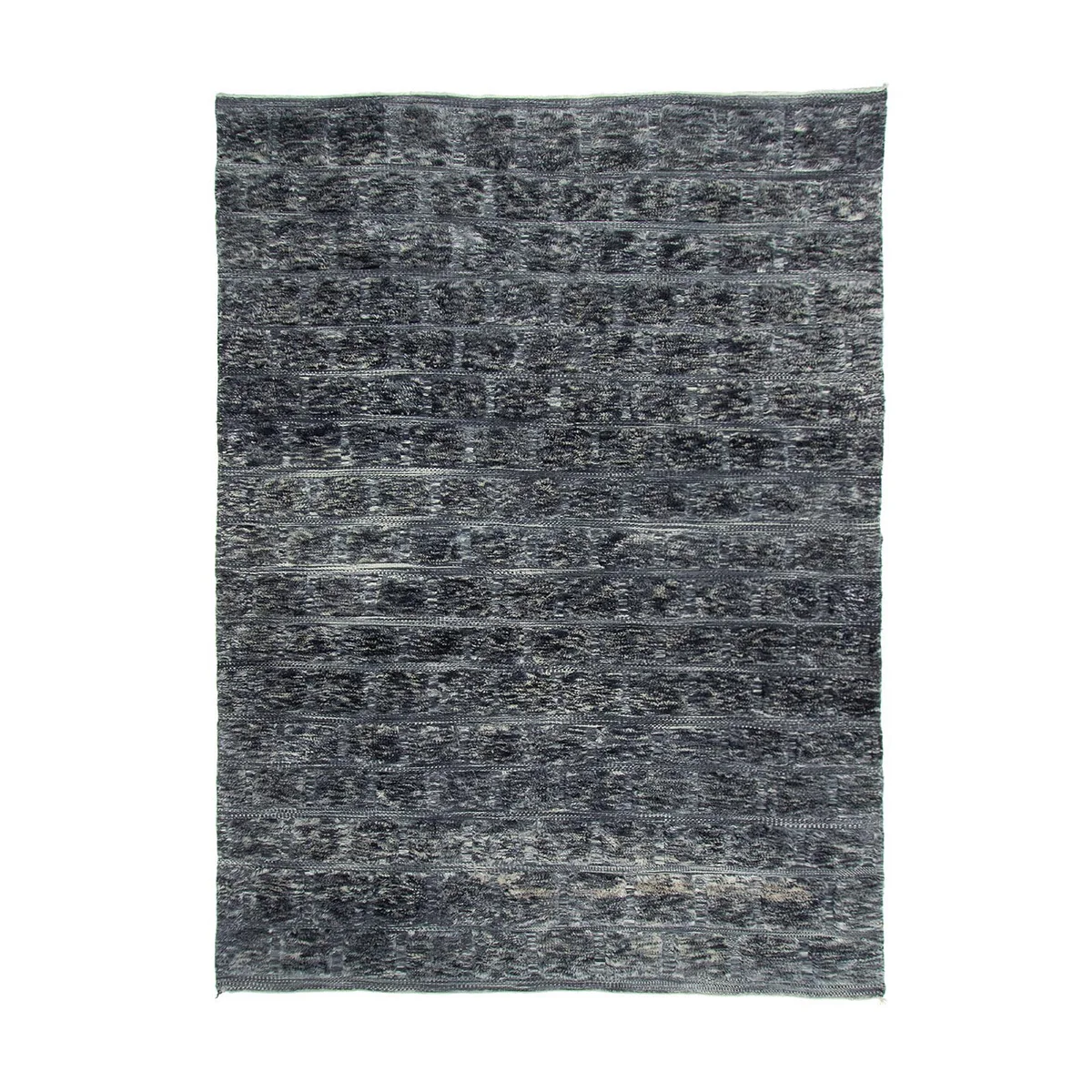 A textured gray rug with a dark, mottled pattern covering an entire rectangular surface.