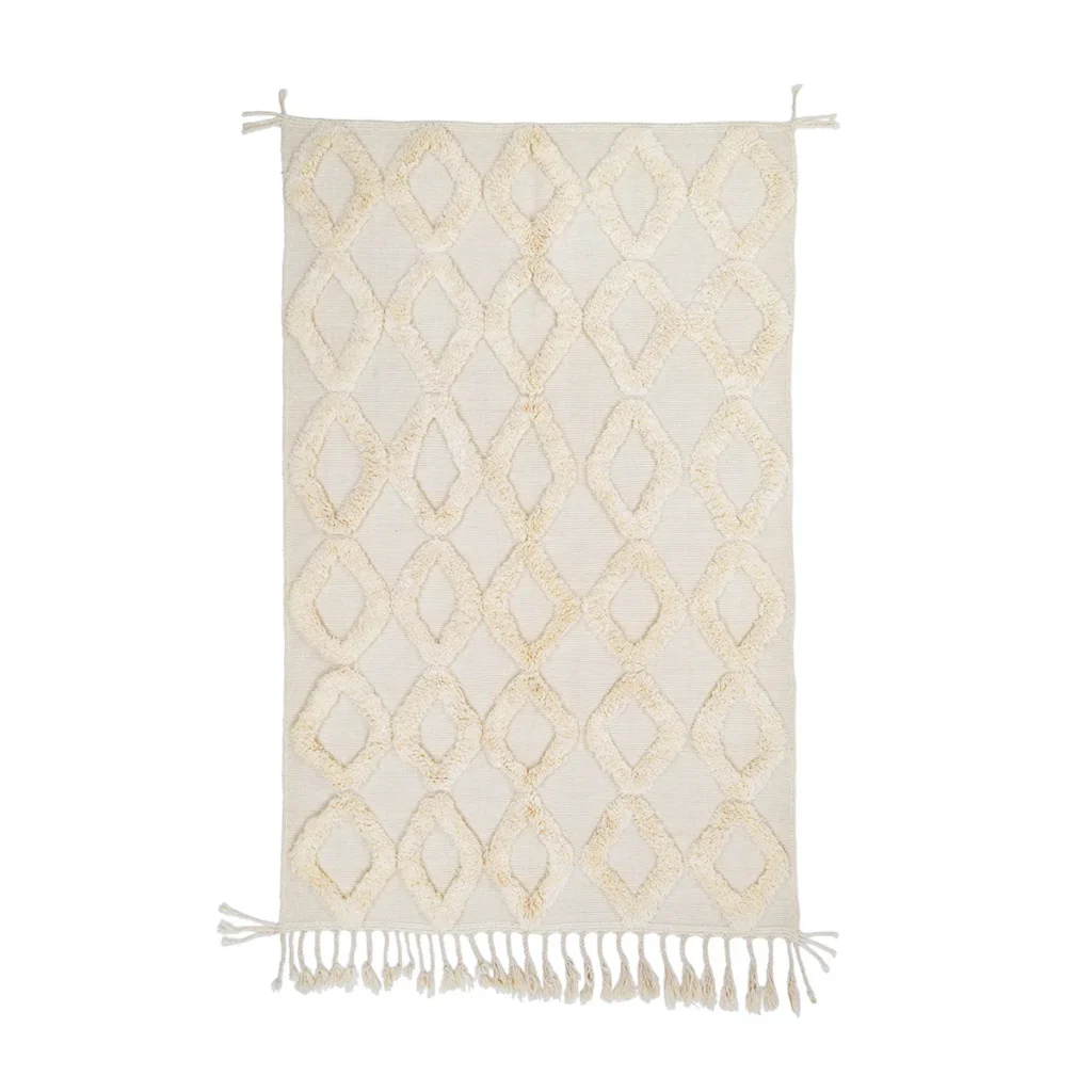A rectangular cream-colored rug with a geometric diamond pattern and fringes on both shorter ends.