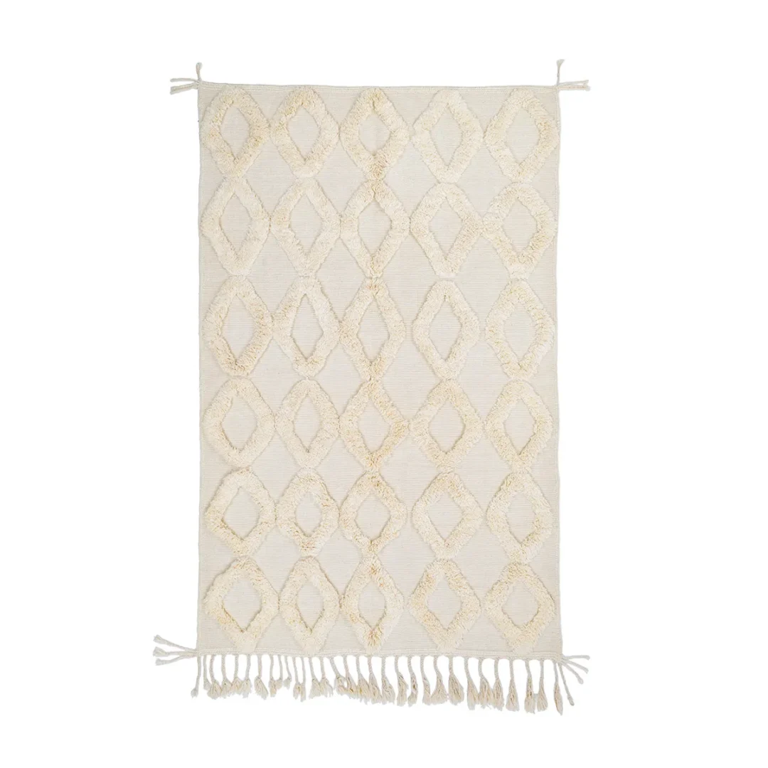 A rectangular cream-colored rug with a geometric diamond pattern and fringes on both shorter ends.