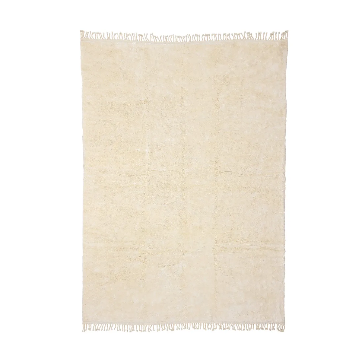 A rectangular, cream-colored rug with a slightly textured surface and fringed edges on both shorter sides.