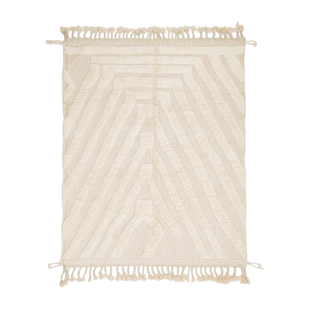 Rectangular off-white rug with geometric tufted patterns and fringed edges on the shorter sides, displayed on a white background.