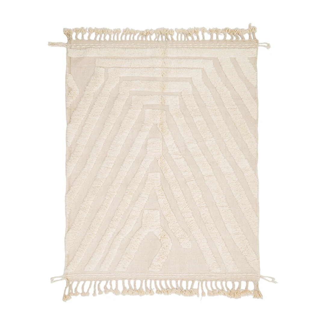 Rectangular off-white rug with geometric tufted patterns and fringed edges on the shorter sides, displayed on a white background.