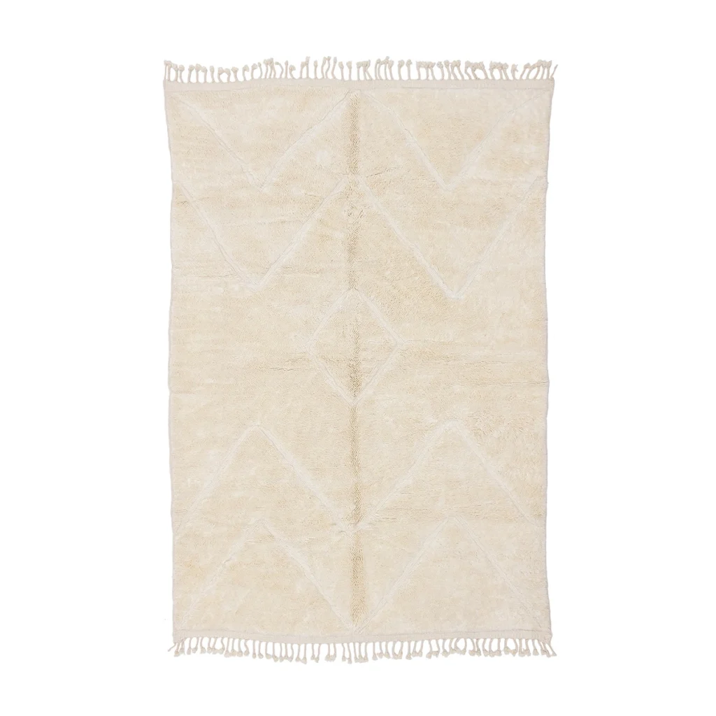 Rectangular cream-colored rug with subtle geometric patterns and fringe along the shorter edges, displayed on a white background.