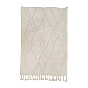 A cream-colored area rug with a diamond pattern and tassels along one edge, displayed against a white background.