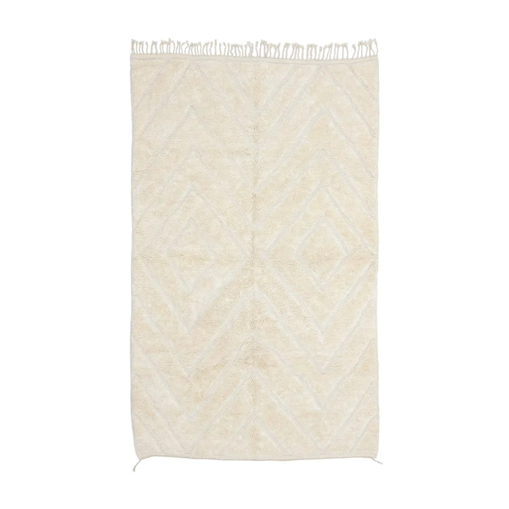 Rectangular cream-colored rug with a subtle geometric diamond pattern and fringes on the shorter edges, shown on a white background.