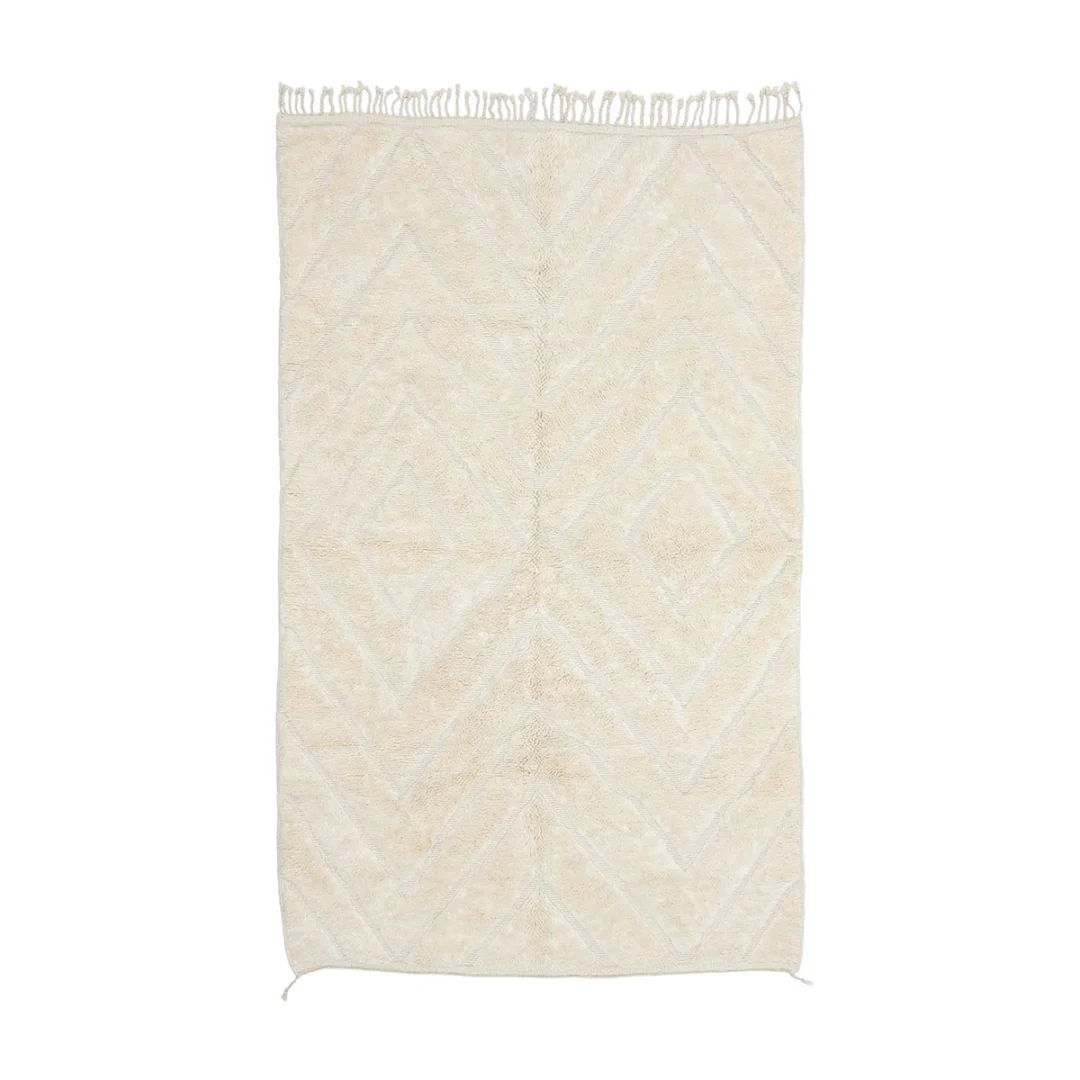 Rectangular cream-colored rug with a subtle geometric diamond pattern and fringes on the shorter edges, shown on a white background.