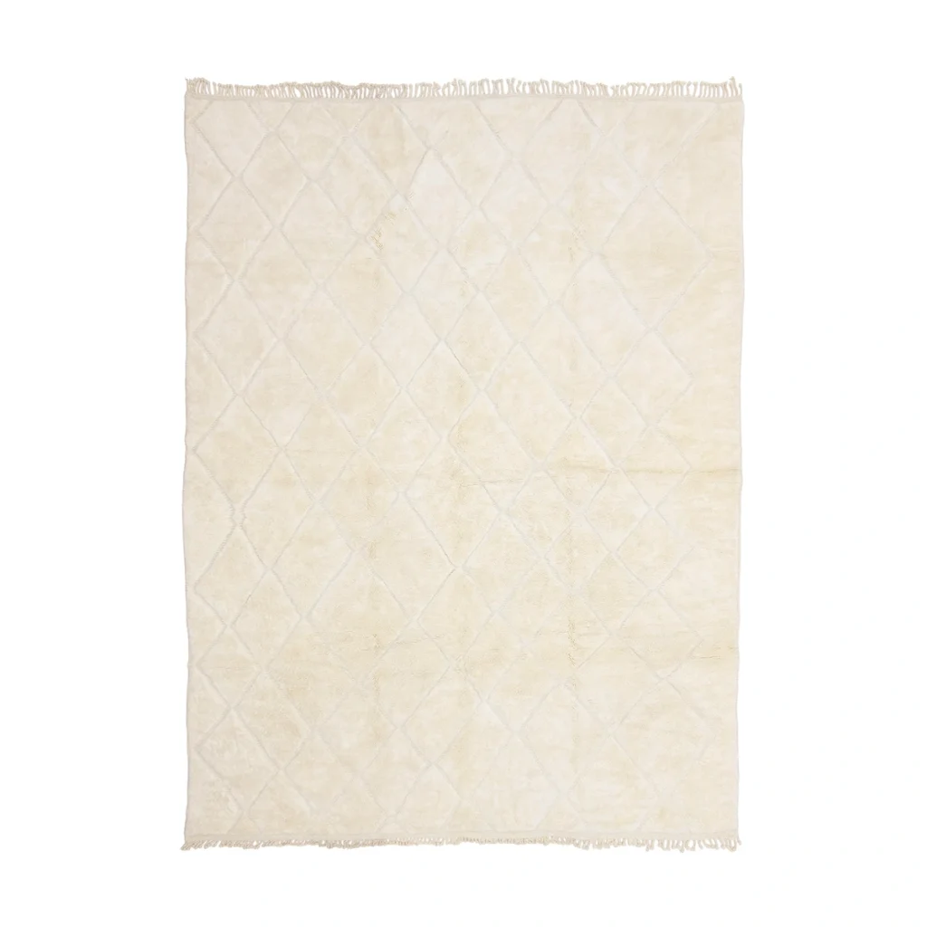 A rectangular cream-colored rug with a subtle diamond pattern and short fringe along the shorter edges is shown on a white background.