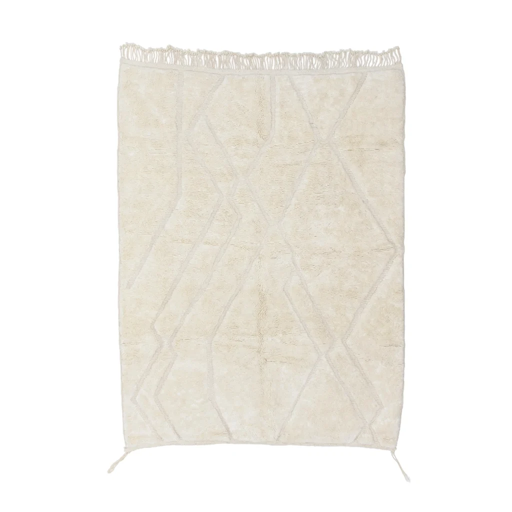 A rectangular off-white rug with a subtle geometric pattern and short fringe on the top edge.
