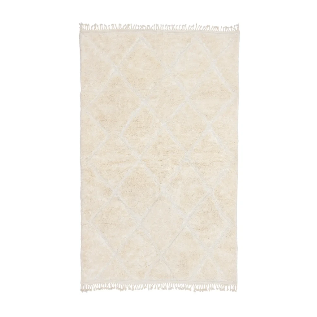 Rectangular cream-colored rug with a subtle diamond pattern and short fringe on both shorter edges, displayed on a white background.
