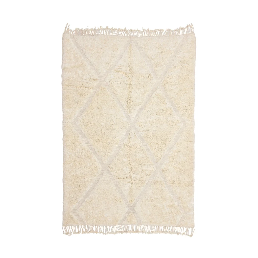 Rectangular cream-colored rug with a subtle diamond pattern and fringe on the shorter edges, displayed against a white background.