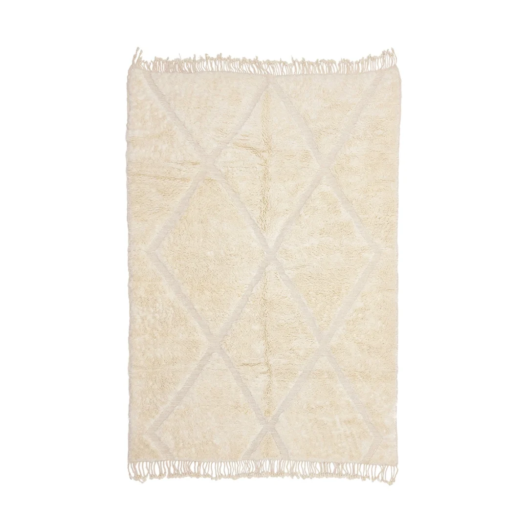 Rectangular cream-colored rug with a subtle diamond pattern and fringe on the shorter edges, displayed against a white background.