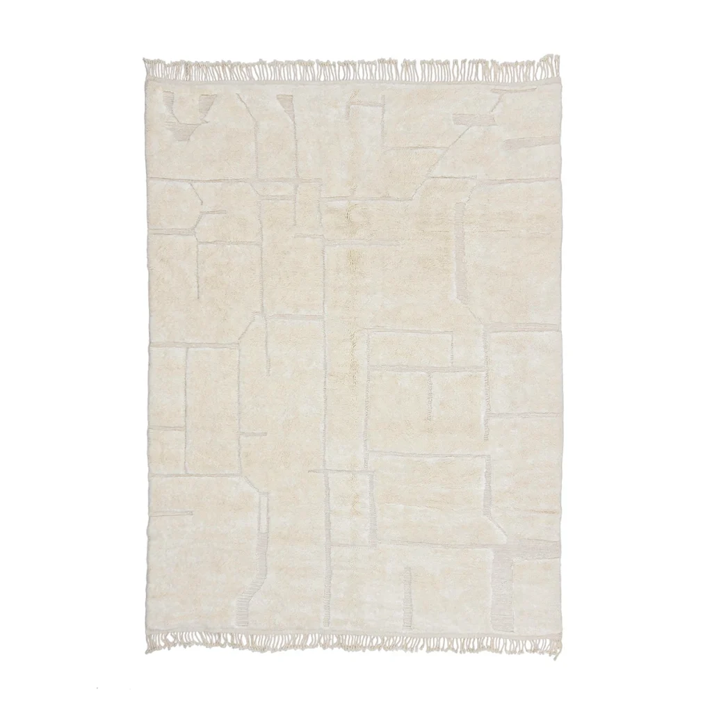 A rectangular, off-white rug with a subtle geometric pattern and fringe on two opposite edges, laid flat on a white background.