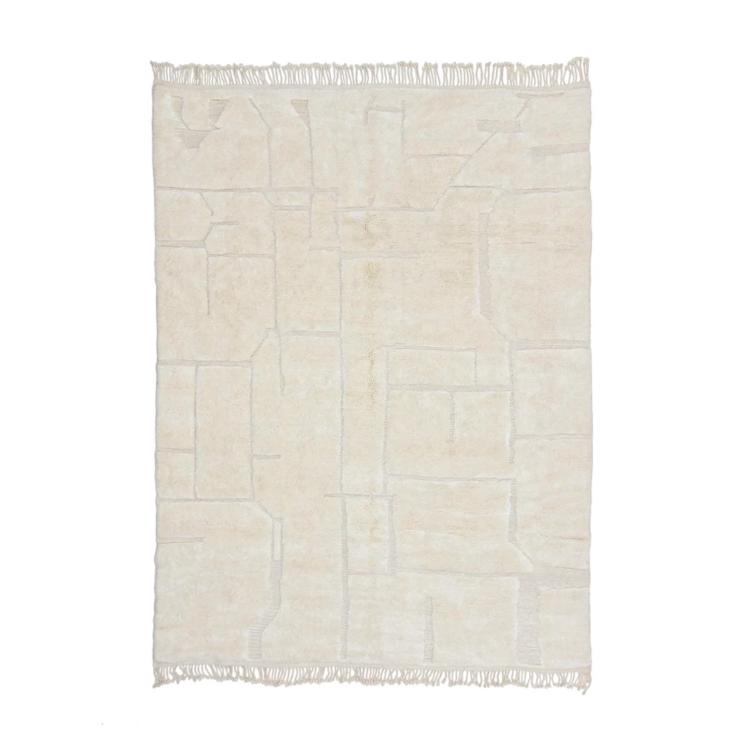 A rectangular, off-white rug with a subtle geometric pattern and fringe on two opposite edges, laid flat on a white background.