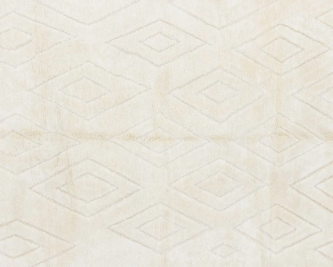 Beige fabric with a subtle, repeating diamond geometric pattern woven into the material.