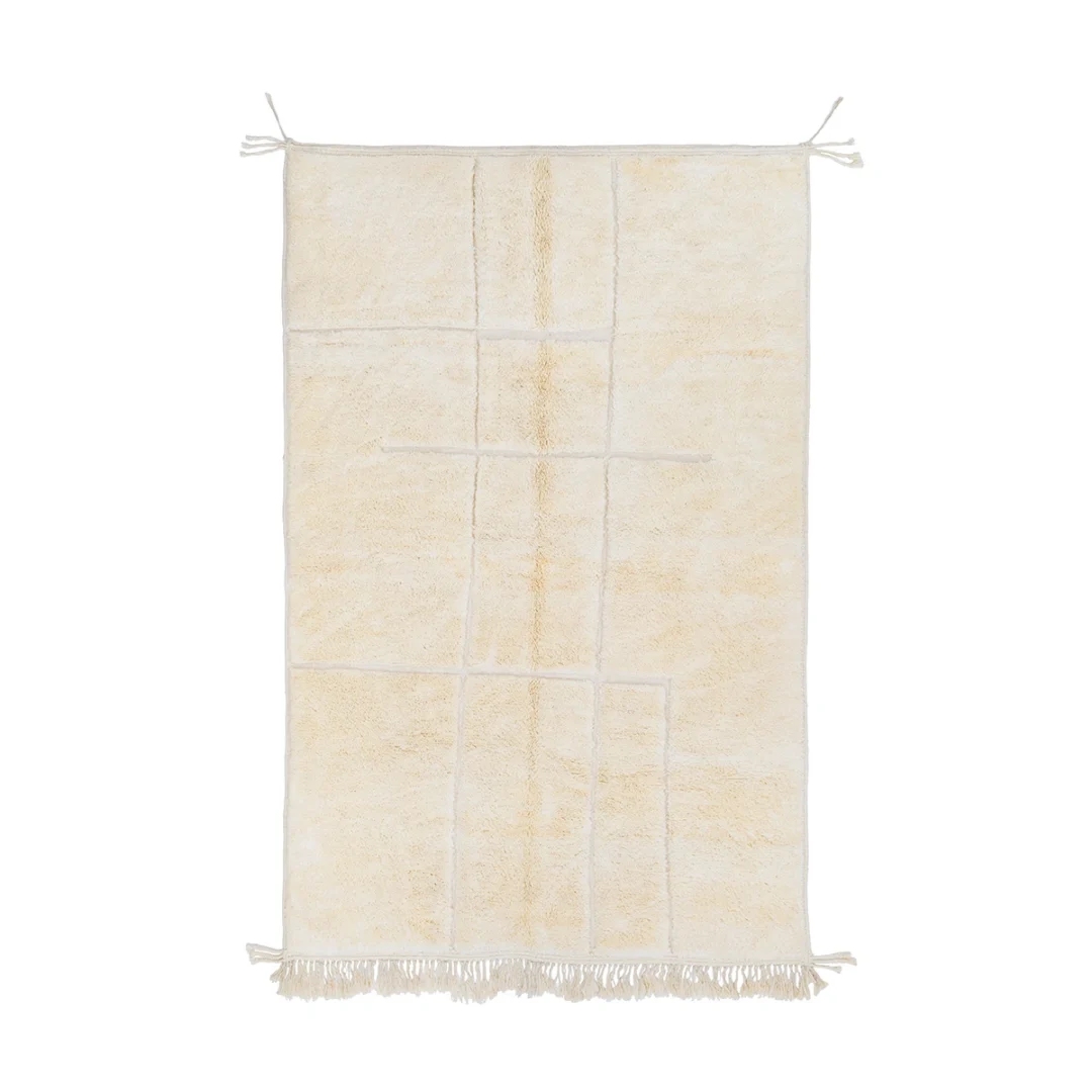 A rectangular, off-white rug with a subtle geometric line pattern, fringes at the bottom edge, and ties at the top corners.