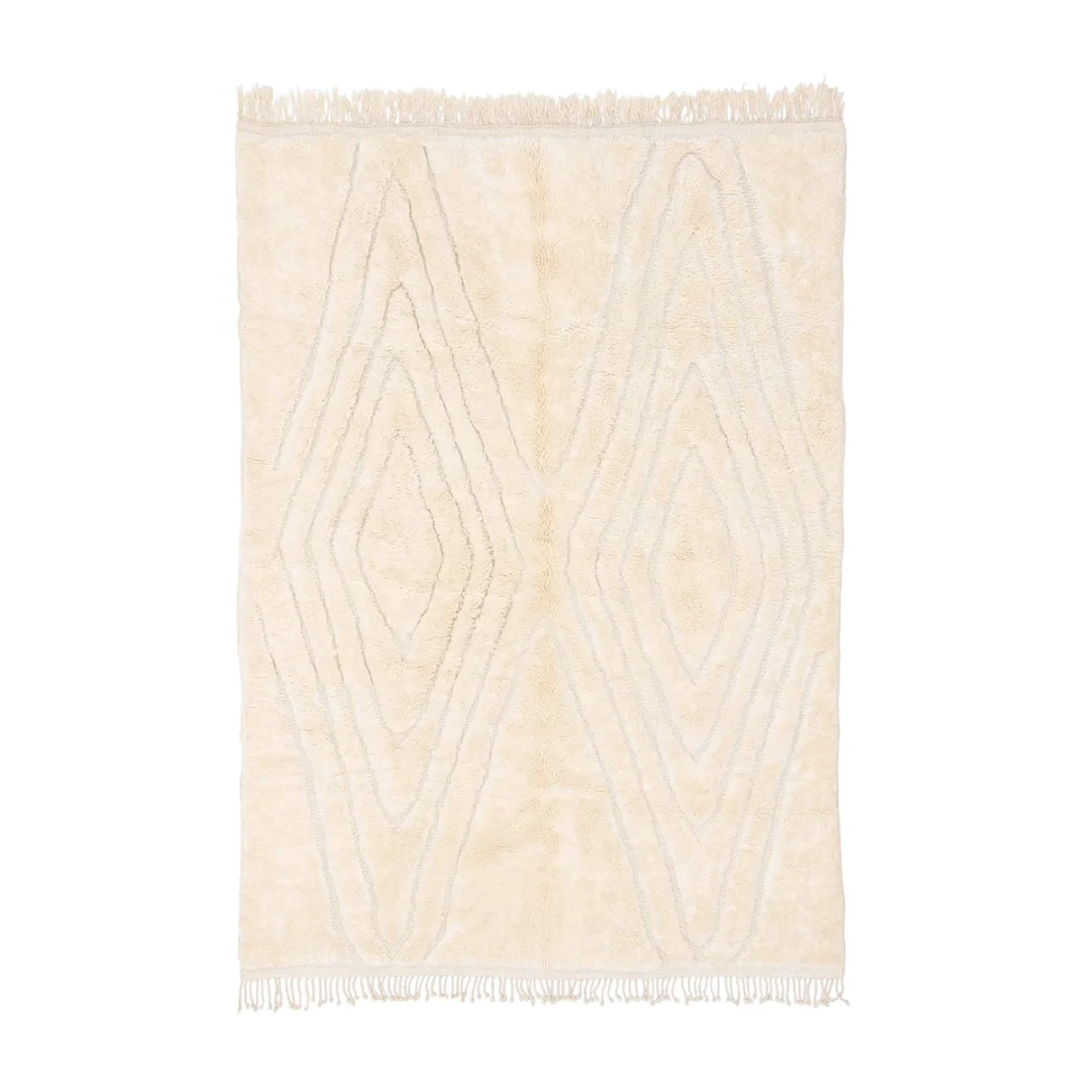 Rectangular cream-colored rug with raised diamond patterns and fringe on the shorter edges, displayed on a white background.