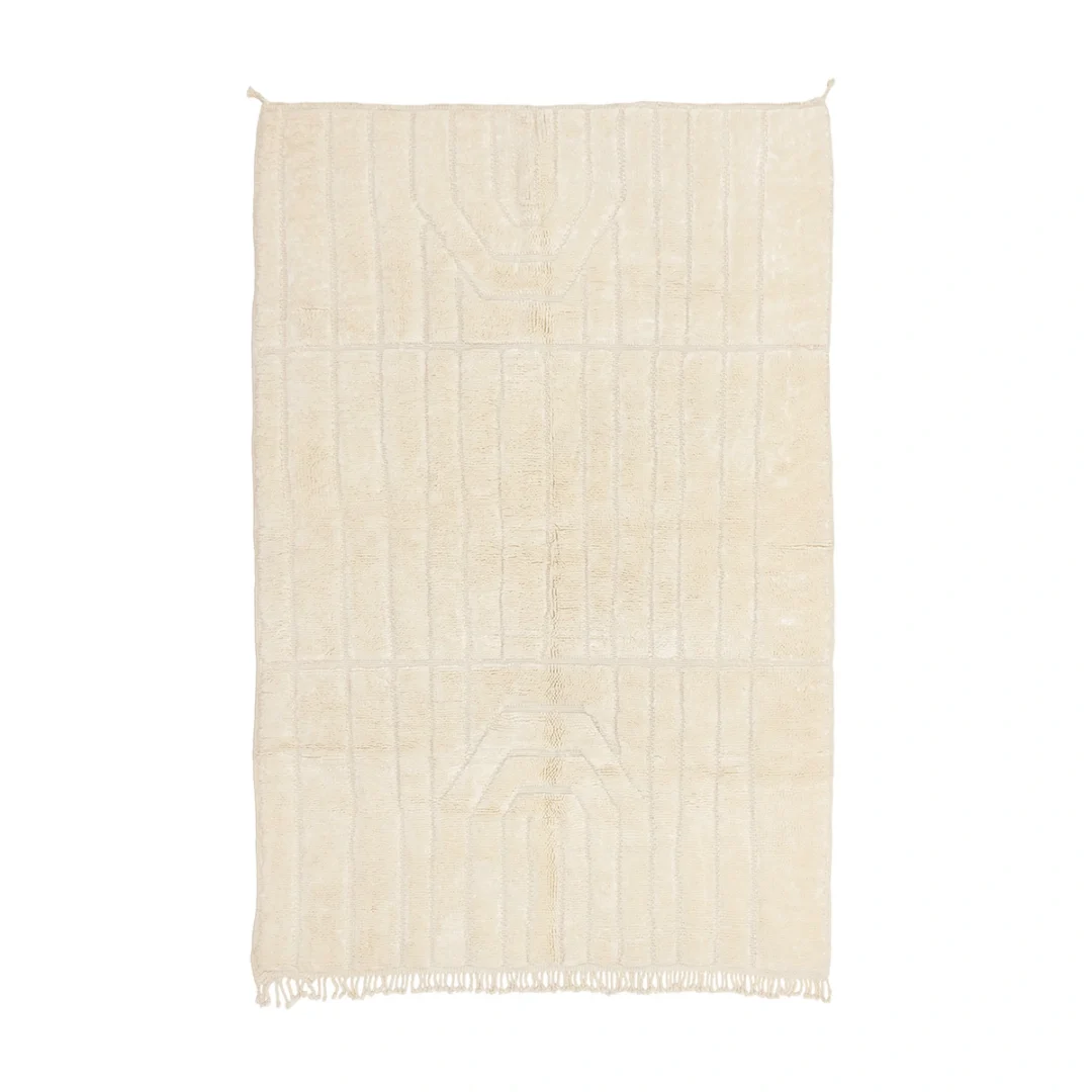 A rectangular, off-white textured rug with subtle geometric patterns and fringe on the bottom edge, displayed on a white background.