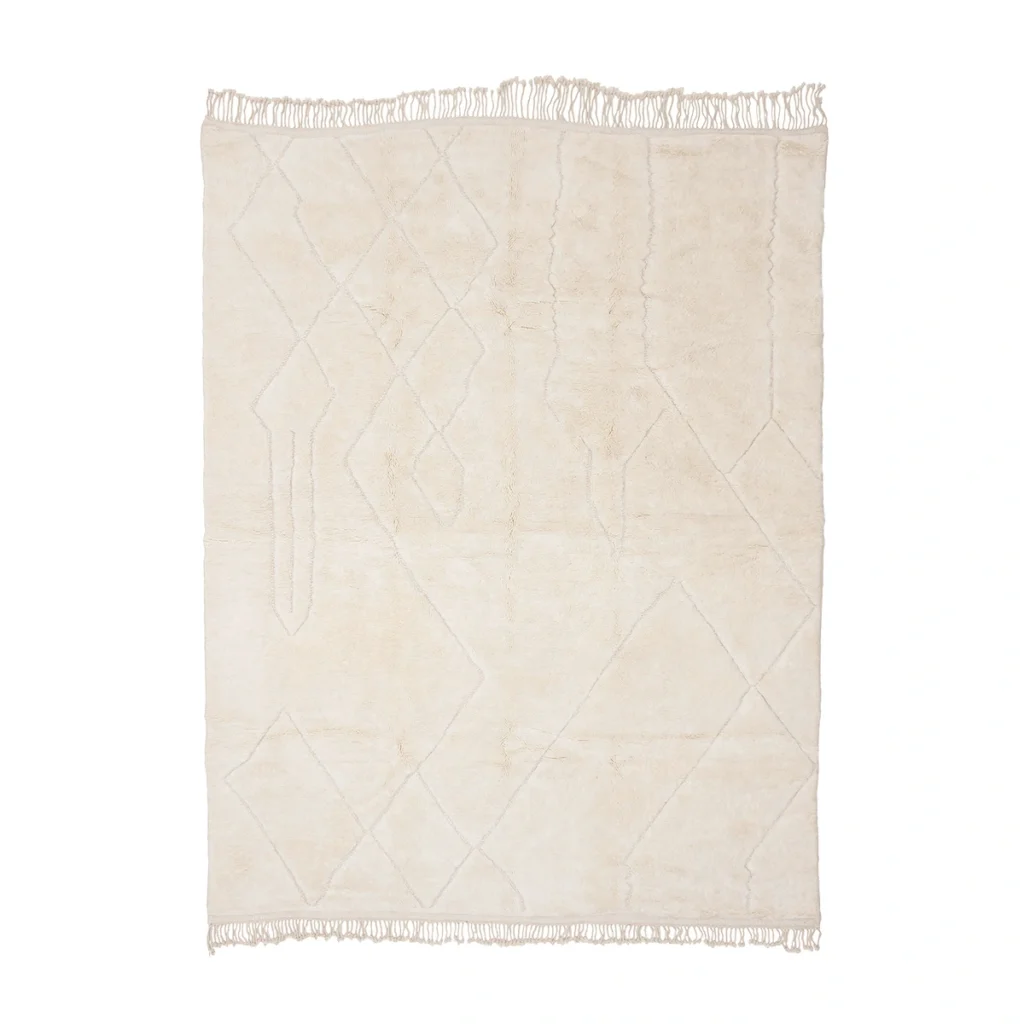 A rectangular off-white rug with subtle geometric line patterns and fringe on the shorter edges, shown against a white background.
