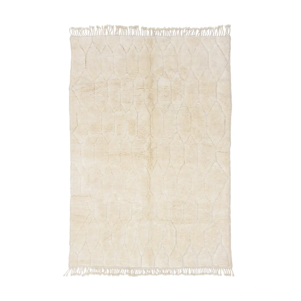 A rectangular beige rug with a subtle geometric pattern and fringed edges on the shorter sides.